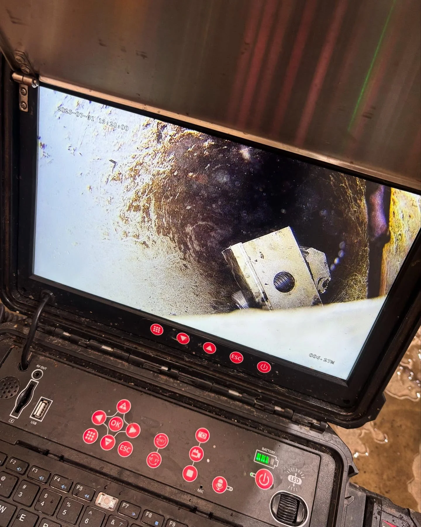 Drain-camera monitor showing the inside of a pipe during an R&J inspection