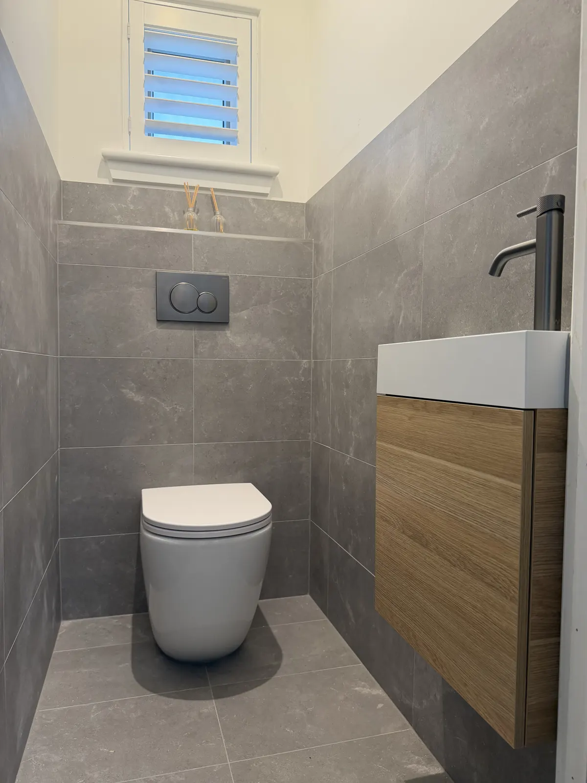 Redesigned Somerton Park toilet room with a second toilet and slimline timber vanity